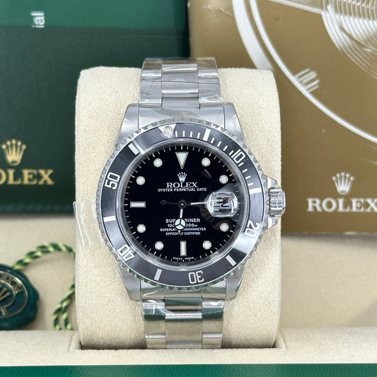 A pre-owned Rolex Submariner Date reference 16610 watch from 1999 with a black dial, stainless steel case, and Oyster bracelet.