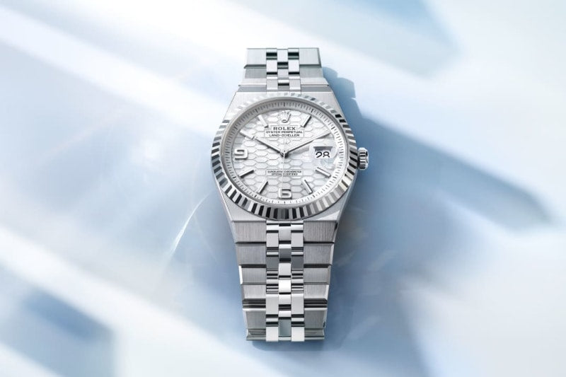 Unworn 2025, Rolex Land-Dweller 40, Oystersteel and 18k White Gold, Intense white dial, Fluted Flat Jubilee, Ref# 127334-0001, Main view