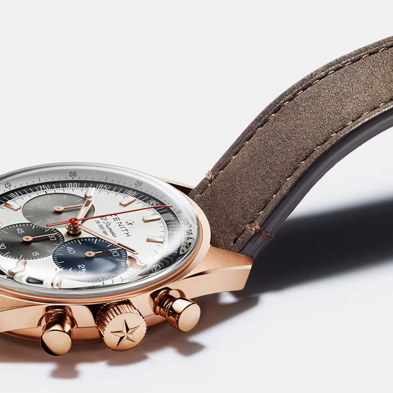 Luxury chronograph watch with a rose gold case, gray dial, and brown leather strap.