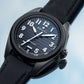 Black Zenith Pilot watch with a striped dial, white numerals, and black fabric strap.