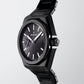 Black octagonal watch with textured dial, silver accents, and a black bracelet.