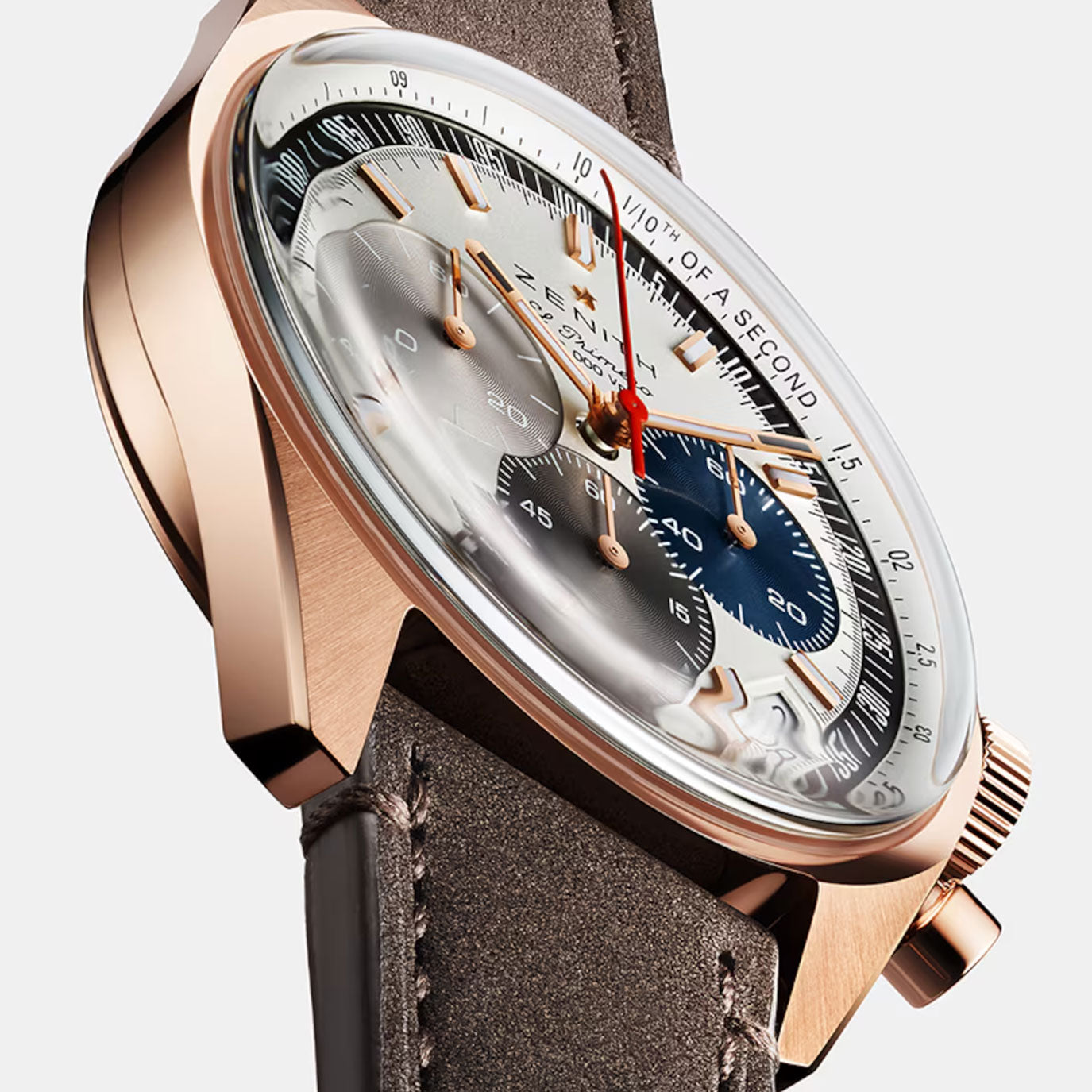 Elegant rose gold chronograph watch with a silver and blue dial on a brown leather strap.